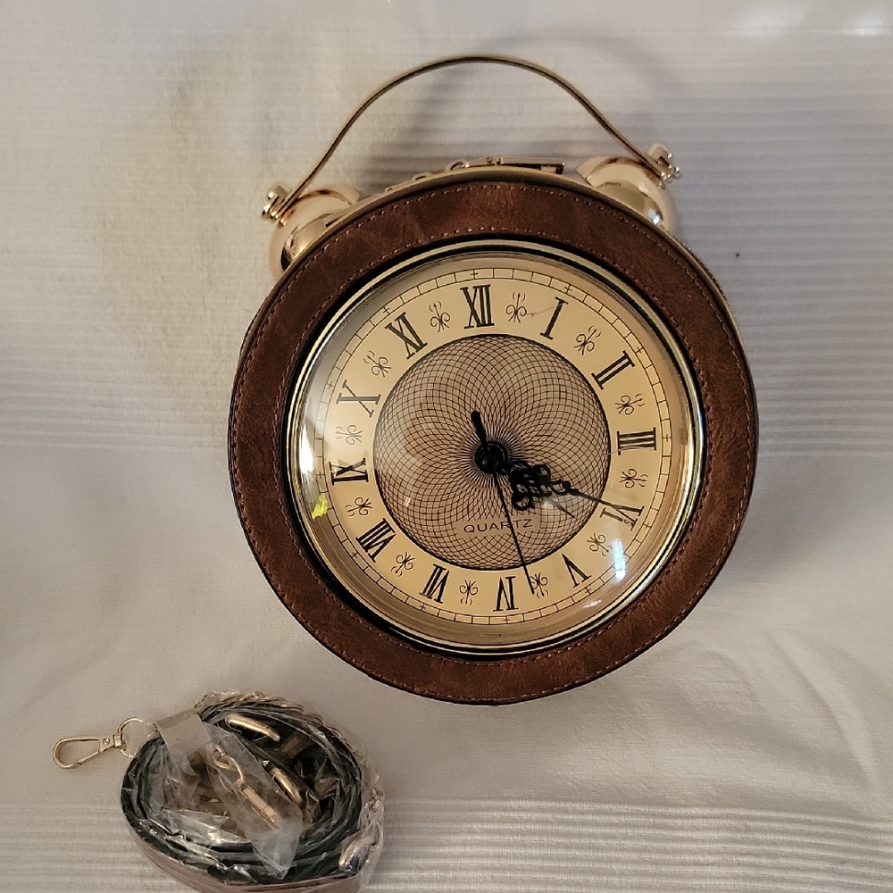 novelty clock-shaped‎ handbag that features a real, working quartz clock face.